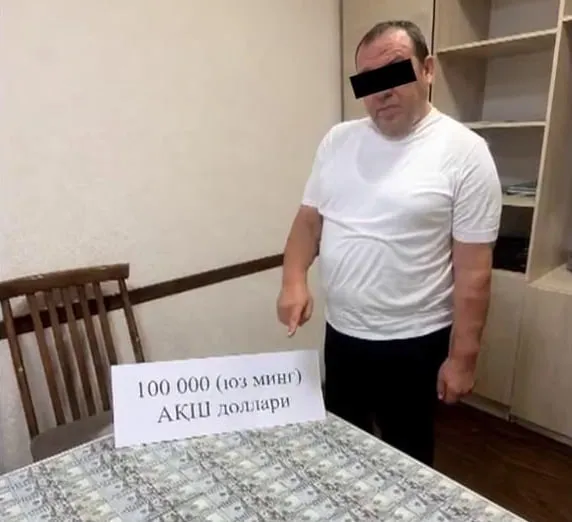 'Тошкентда ер майдонини ҳужжатлаштириб беришни ваъда қилган шахс 100 минг доллар билан ушланди'ning rasmi